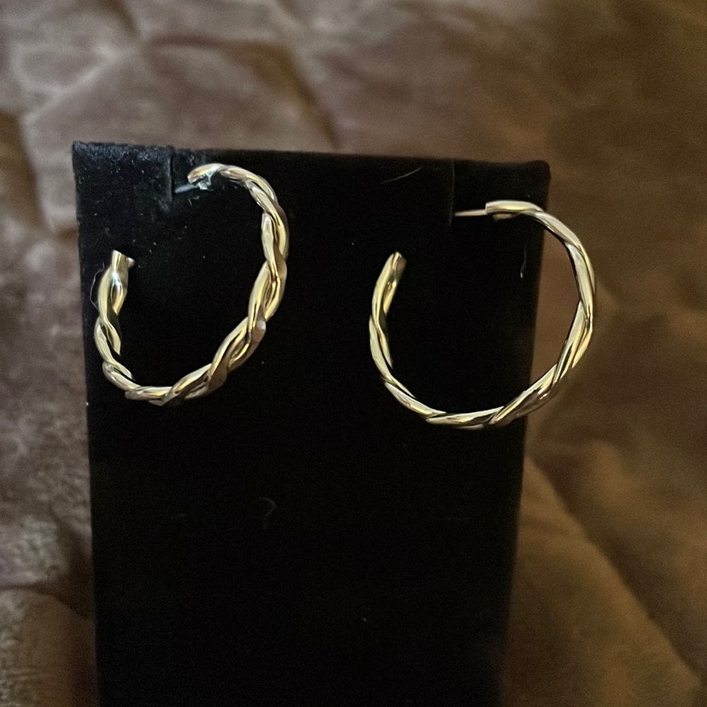Silver tone twisted hoop earrings